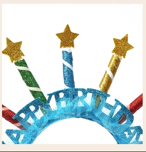 Detail of Happy Birthday headband with mesh ruffles and glitter candle stars