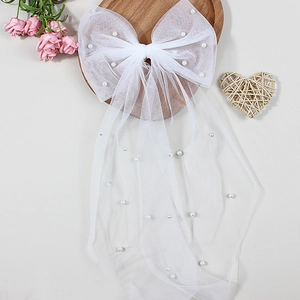 Barrette nœud de mariée en résille blanche avec perles et longs rubans pour mariage
