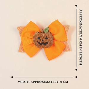 Handmade Halloween pumpkin bow hair clips with orange sequins and festive glitter layers