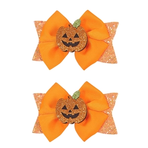 Handmade Halloween pumpkin bow hair clips with double-layered glitter sequins for kids