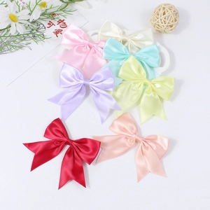 Handmade satin bow hair clips in multiple colors like pink, blue and red for girls