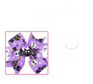 Detail of Halloween hair bow featuring ghost cat print and a black bat centerpiece