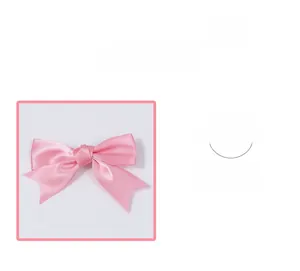 Detail view of the pink satin bow hairclip showing smooth fabric texture and knotted center