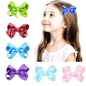 3-inch grosgrain ribbon bow hair clips for kids in various bright colors with model display