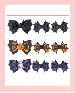 Vue détaillée du lot de 9 nœuds à cheveux Halloween avec motifs chauve-souris et citrouille