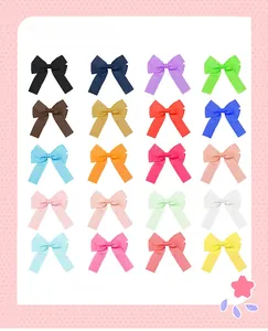 Dettaglio di 20 fiocchi per capelli in nastro grosgrain in una vasta gamma di colori vivaci