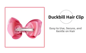 Detailed view of the pink satin bow hair clip featuring a durable silver metal alligator clip