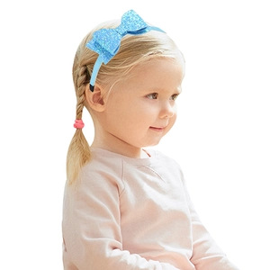 Sparkling blue glitter bow headband for girls, cute rainbow kids hair accessory on model