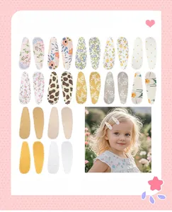 Assorted collection of fabric teardrop hair clips with floral, leopard, and polka dot prints