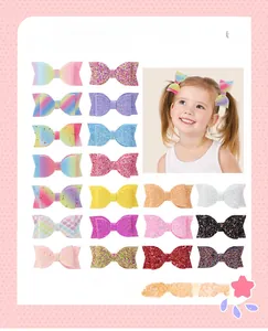 Detail view of colorful glitter bow hair clips for kids in various sparkling patterns