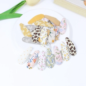 Assorted fabric wrapped snap hair clips with floral and leopard patterns for girls