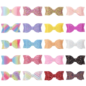 20-piece set of handmade glitter bow hair clips in assorted colors and patterns