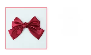 Close-up of dark red satin bow hair clip showing smooth fabric texture and layered design
