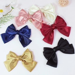 Set of six colorful handmade satin bow hair clips in elegant pastel and dark shades