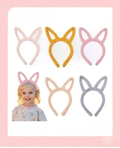 Detailed plush rabbit ear headband collection showing soft textures in multiple pastel colors