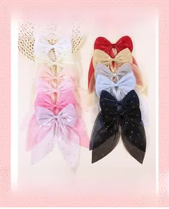 Detailed collection of handmade sheer mesh bow hair clips with shimmering rhinestones