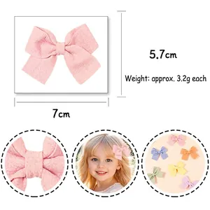 Barrette à cheveux nœud rose pour enfants, dimensions 7cm x 5,7cm et texture douce