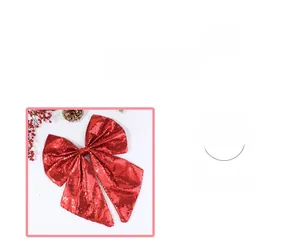 Detail of red glitter Christmas bow ornament with shimmering sequins and flowing ribbons