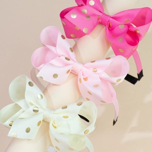 Set di tre cerchietti per bambini con fiocchi a pois dorati in rosa e bianco crema