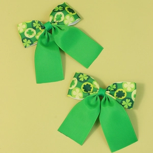 Set of two St. Patrick's Day grosgrain ribbon hair bows with green shamrock pattern