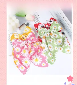 Three-piece set of large daisy print chiffon bow hair clips in pink, yellow and green