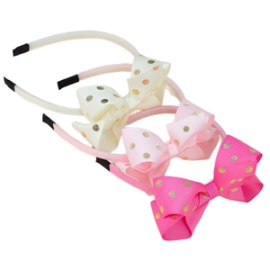Set di 3 cerchietti per bambine con fiocchi a pois dorati nei colori crema, rosa e magenta