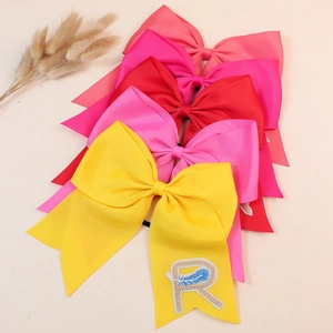 Lot de grands chouchous nœuds en tissu avec broderie détaillée sur élastiques noirs extensibles