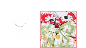 Close-up of daisy print bow hair clips in red and green satin with floral details