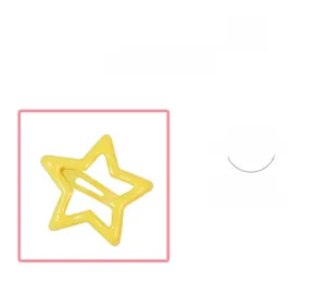 Detail of a bright yellow star hair clip with smooth metal lacquer finish for kids
