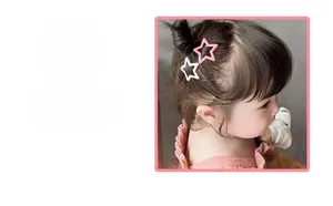 Detail showing two sweet colorful star hair clips in pink and white for girls