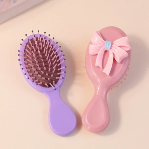 Set di mini spazzole per capelli portatili con fiocco rosa e design a cuscinetto