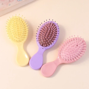 Set di tre mini spazzole per capelli portatili con cuscino d'aria in colori macaron