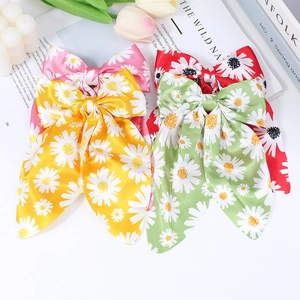 Floral daisy bow hair clips set in pink yellow green and red satin fabric