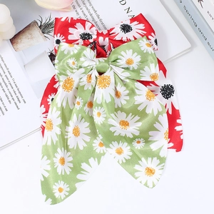 Floral daisy bow hair clips in red and mint green with elegant long ribbon streamers