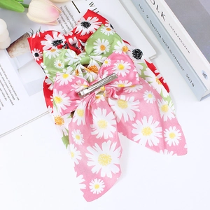 Daisy print bow hair clips set for girls in red, green, and pink satin fabric
