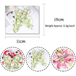 Floral daisy print bow hair clip for girls with elegant fabric and metal duckbill clip