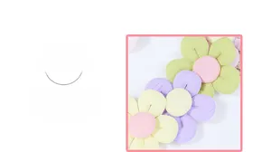 Detailed close-up of handmade fabric five-petal flowers in pastel colors with fine textures