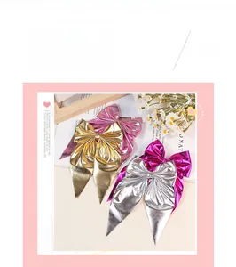 Set of four satin ribbon bow hair clips in gold, silver, pink, and rose red colors