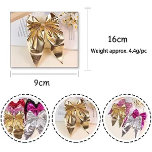 Elegant metallic bow hair clip in gold finish with dimensional 16cm x 9cm measurements