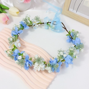 Floral princess crown with blue and white flowers and adjustable light blue ribbon