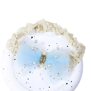 Baby girl elastic lace headband featuring a light blue tulle bow with white pearls