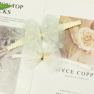 Green and off-white elastic baby headbands with multi-layered mesh tulle bows