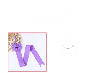 Detail of purple grosgrain ribbon hair accessory organizer with a multi-layered bow