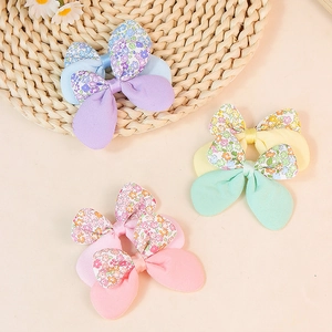 Floral and solid fabric bow hair accessory set with rabbit ear design in pastel colors