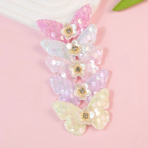 Vijf glinsterende vlinder haaraccessoires met kleine witte bloemen en glanzende strass