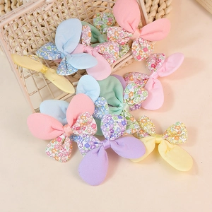 Assorted floral and solid color fabric bow accessories for DIY children clothing and crafts