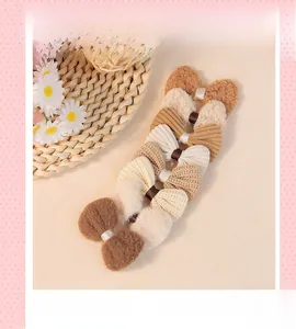 Close-up of brown wool bow hair accessories with corduroy and plush textures