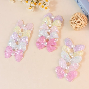 Sparkly sequin butterfly hair bows with faux pearls in pastel macaron colors
