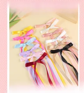 Detailed collection of long satin ribbon bow hair clips in various elegant solid colors