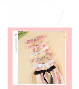 Elegant collection of long satin ribbon bow hair clips in various pastel and classic colors